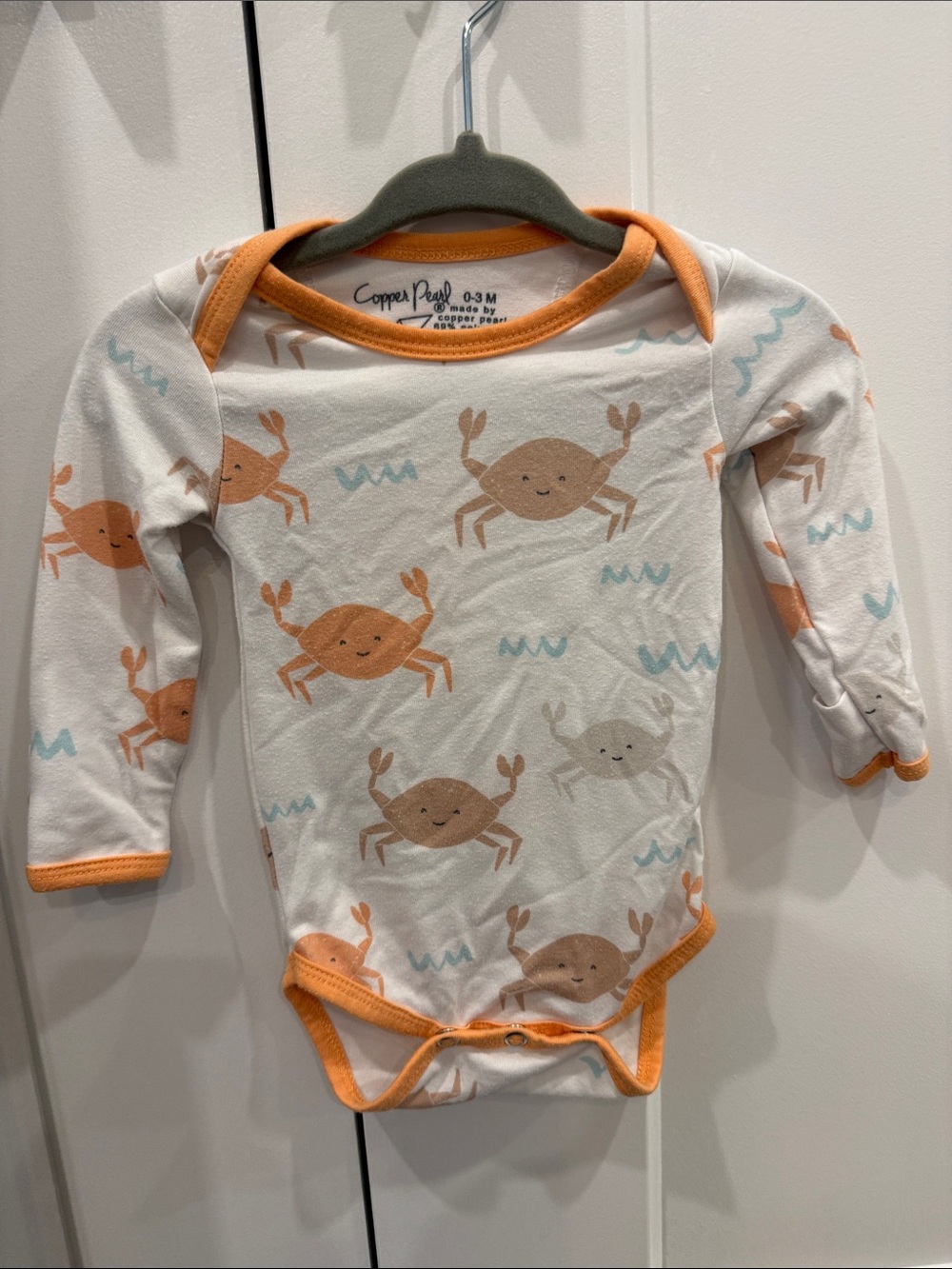 Copper Pearl Crab-Print Long Sleeve One-Piece in Cream and Orange